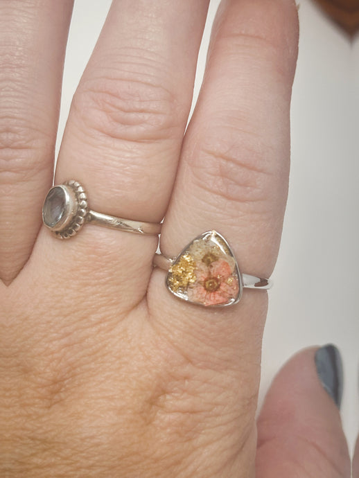 925 Sterling Silver Adjustable Ring-Coral and White flowers cast inside resin.