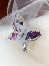 Load image into Gallery viewer, Matte Blue Butterfly Clip Infused with Real Flowers in Resin.