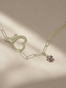 Paper clip charm necklace with front large heart shaped clasp