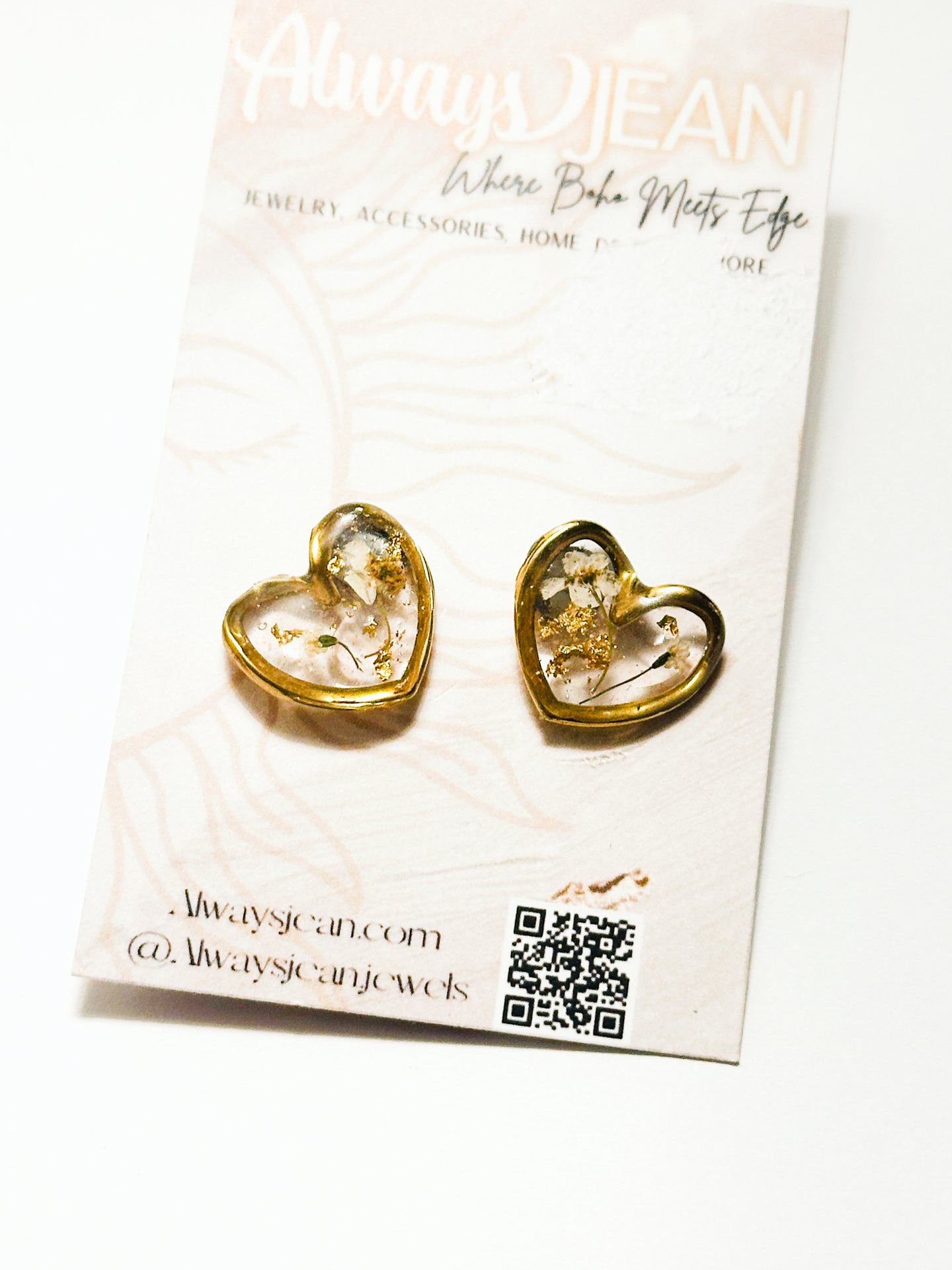 Brass hearts filled with resin and real pressed flowers.